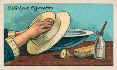Een witte strooien hoed schoonmaken (chromolitho) door English School