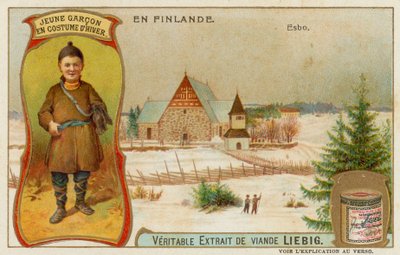 Jongen gekleed voor de winter en de stad Esbo door European School
