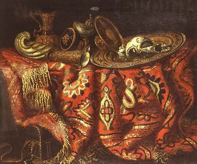 Een nautilusbeker, een pateen, kannen en een vergulde schaal op een tapijt over een rand gedrapeerd door Francesco (circle of) Fieravino