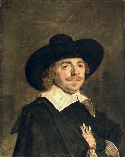 Een klein portret van een man met handschoenen door Frans Hals