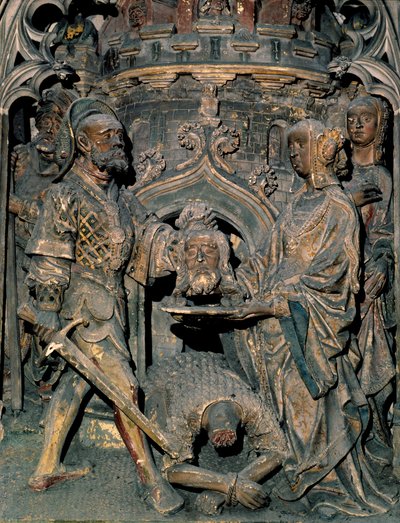 De dood van Johannes de Doper. Het hoofd van Johannes de Doper wordt op een schaal gelegd die Salome aan haar moeder presenteert. Gesneden reliëf van de Kathedraal Notre-Dame d