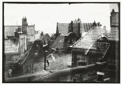 Gezicht over daken in Amsterdam door George Hendrik Breitner