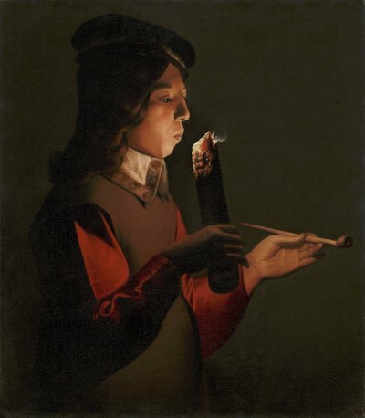 Een jonge jongen met een pijp, blazend op een brandende tak door Georges de La Tour