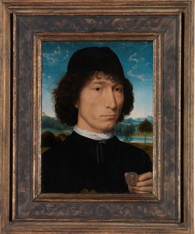 Portret van een man met een Romeinse medaille door Hans Memling