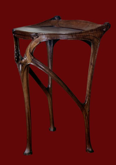 Art Nouveau: perenhouten tafel gemaakt door Hector Guimard (1867-1942) door Hector Guimard