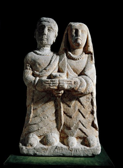 Iberische kunst: beeldje van een paar dat een offer brengt. Beeldhouwwerk uit Albacete, Cerro de los Santos, Spanje. 4e-2e eeuw v.Chr. Madrid, Nationaal Archeologisch Museum door Iberian