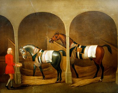 Een stalknecht die twee paarden voert in een stal door James Seymour