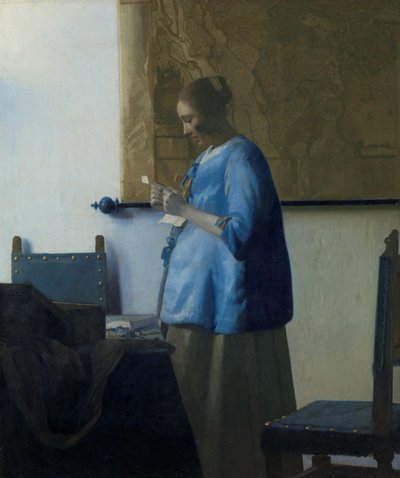 Vrouw in blauw die een brief leest door Johannes Vermeer
