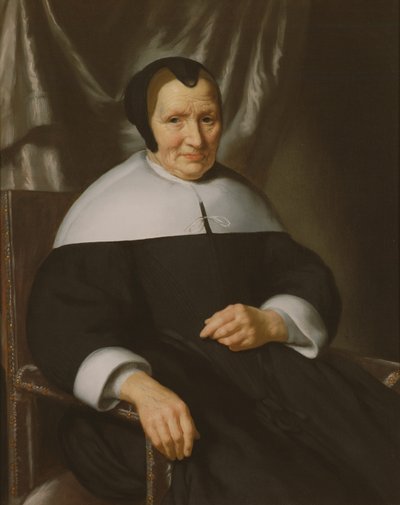 Portret van een dame zittend in een leunstoel door Nicolaes Maes