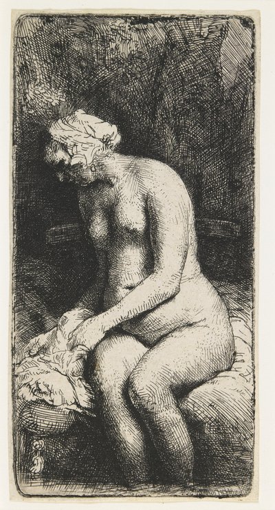 Vrouw die haar voeten baadt in een beek door Rembrandt van Rijn