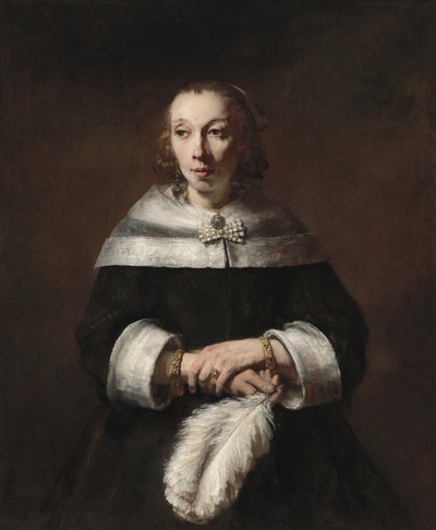 Portret van een vrouw met een struisvogelveren waaier door Rembrandt van Rijn