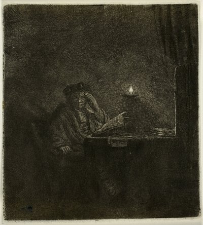 Student aan een tafel bij kaarslicht door Rembrandt van Rijn