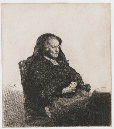 De moeder van de kunstenaar zittend aan een tafel, kijkend naar rechts: drie kwart lengte door Rembrandt van Rijn