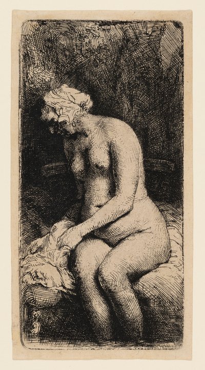 Vrouw die haar voeten wast in een beek door Rembrandt van Rijn