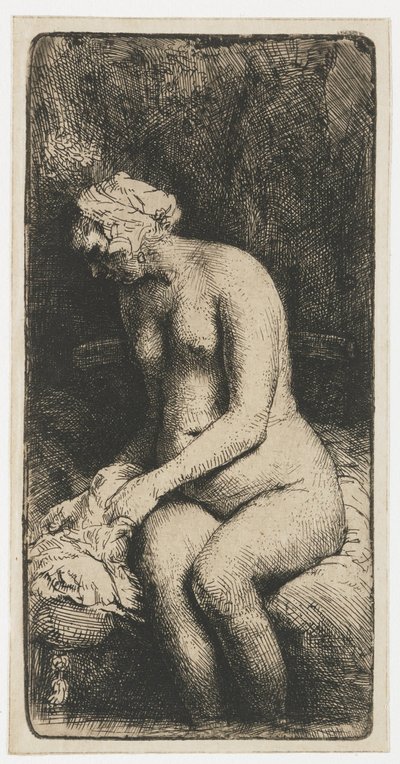 Vrouw die haar voeten baadt in een beek door Rembrandt van Rijn