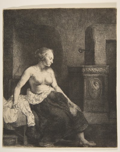 Halfgeklede Vrouw Zittend naast een Kachel door Rembrandt van Rijn