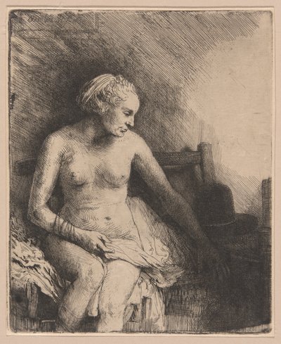 Vrouw in bad met een hoed naast haar door Rembrandt van Rijn