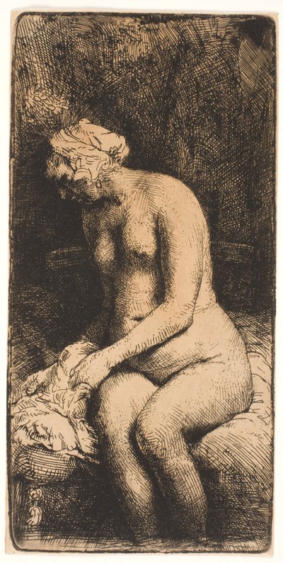 Vrouw die haar voeten baadt in een beek door Rembrandt van Rijn