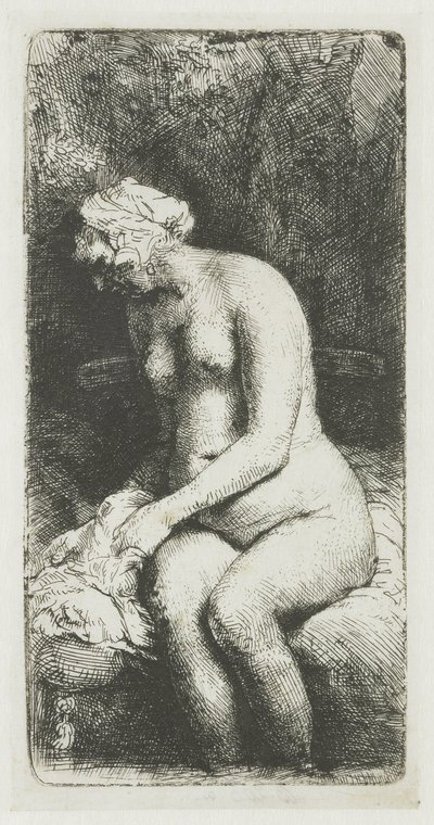 Vrouw die haar voeten baadt in een beek door Rembrandt van Rijn