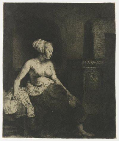 Vrouw half aangekleed naast een kachel door Rembrandt van Rijn