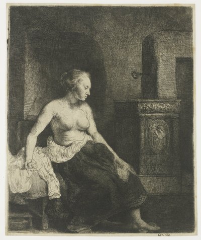 Vrouw half aangekleed zittend naast een kachel door Rembrandt van Rijn