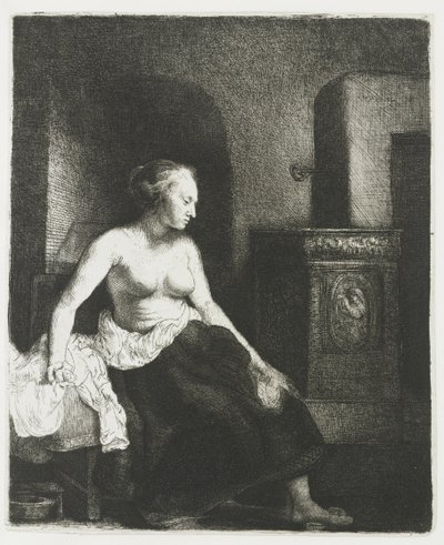 Zittende half aangeklede vrouw naast een kachel door Rembrandt van Rijn