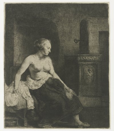 Vrouw zittend half aangekleed naast een kachel door Rembrandt van Rijn