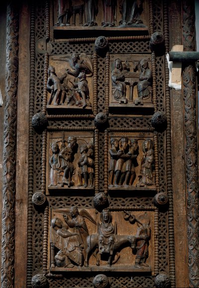 Romaans kunst: houten deur uit het midden van de 12e eeuw van de Kerk van St. Maria van het Kapitool in Keulen, Duitsland (Sankt Maria im Kapitol, Keulen). Scènes die de aankondiging aan de herders, de geboorte, de aanbidding van de wijzen en de door Romanesque