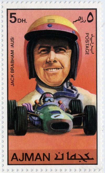 Emiraten Arabische Eenheden postzegel met Australische autocoureur Jack Brabham (geb. 1926) door School Arabic