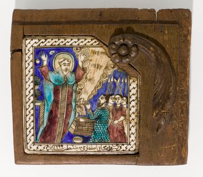 Een gesigneerde en gedateerde Syrische keramische tegel, geschilderd in mangaan, blauw en bruin, gedateerd 1699, 1699 door Syrian School