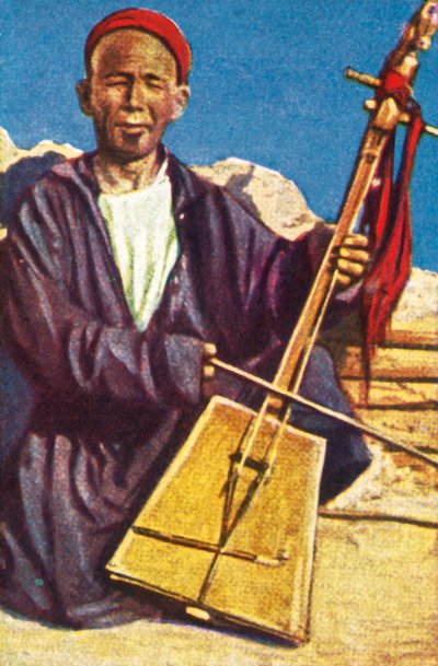 Rondtrekkende muzikant, Mongolië, ca. 1928 door Unbekannt