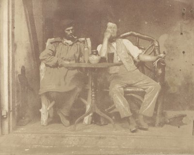 Twee mannen zittend aan een tafel door Unbekannt