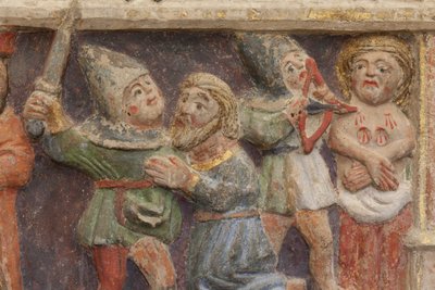 Altaarstuk. polychroom steen. Tweede helft 14e eeuw. Oorsprong voormalige parochiekerk van Torre de Rialb. Detail. Middenregister. Linker paneel. Onderste deel: een ambtenaar kijkt naar de scène bij de onthoofding van Sint Iscle en de amputatie van de bors door Unbekannt