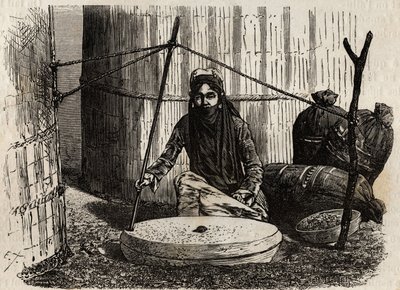 Turkmeense vrouw die de graanmolen gebruikt. Gravure ter illustratie van de reis naar Zuidelijk Afrika van 1840 tot 1856, in 