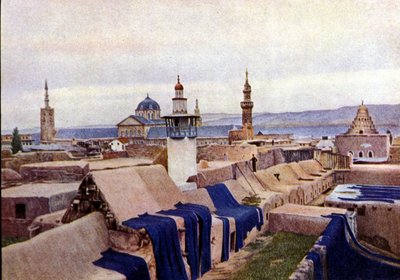 Blauwe katoenen stoffen te drogen gelegd op de daken van ververijen in Damascus (Syrië) door Unknown photographer