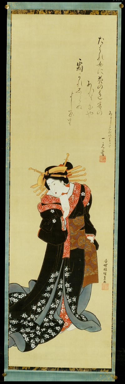 Een staande courtisane in een zwarte kimono met witte bloemen die een prop papier vasthoudt door Utagawa Kunisada
