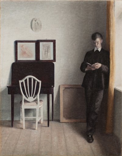 Interieur met een jonge man die leest door Vilhelm Hammershoi