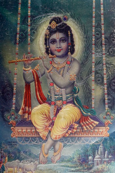 Heer Krishna met fluit. Hindoegod door . .