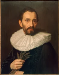 Portret van een man, handschoenen vasthoudend, licht naar links