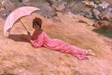 Meisje liggend op het strand met een roze parasol