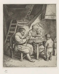 Gezin aan tafel voor de maaltijd