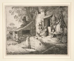 Vrouw die bij de deur van een huisje aan het spinnen is