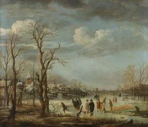Winterlandschap bij een stad met kale bomen