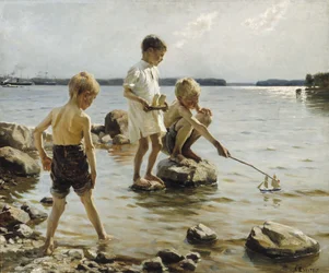 Jongens die op de oever spelen