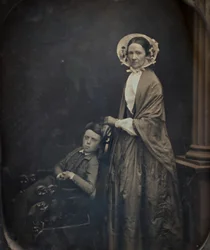 Zonder titel Een vrouw met kap en sjaal, met haar zittende zoon, ca. 1850