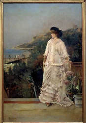 Portret van een vrouw op een terras aan zee