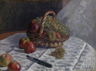 Appels en druiven in een mand