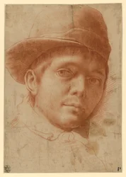 Portret van een jonge man met een pet