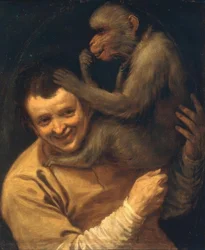 Man met luisterende aap