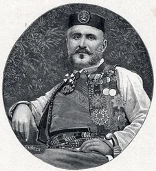 Portret van Nicolaas I van Montenegro (Nikola I Petrović-Njegoš) (Petrović-Njegoš) (1841-1921), vorst van Montenegro en de Brda. Gravure in „Les Missions Catholiques au XIXe Siecle” van Louis-Eugène (Louis Eugène) Louvet. Privécollectie.